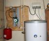 Solar Work Station: Closer view of the work station with a flow meter, pump, one way check valve, shut off valve, expansion tank and blow off valve
