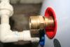 Threads on the Solar Tank: This closeup view of hot water tank heat exchanger fitting shows a .75"  fitting that is not tapered pipe thread. A pipe thread f