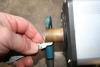 Threads on the solar heater: This closeup of the header fitting threads shows it is not a 14 thread tapered 'pipe' thread but a 'straight' 14 threads per inch
