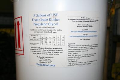 Propylene Glycol: View of label of propylene glycol with ingestion, skin contact and eye contact information. This also shows the the mixing chart.  Propylene Glycol has many uses besides solar heat transfer loops.      * Solvent in the flavor concentrate and fragrance industry, an excipient in elixirs and pharmaceuticals, and a coupling agent in sunscreens, shampoos, shaving creams and other personal care products     * Wetting agent for natural gums to simplify compounding     * Humectant, preservative and stabilizer in diverse applications.     * Raw material to produce high-performance unsaturated polyester resins (UPR) used for marine construction, gel coats, sheet molding compounds and synthetic marble castings     * Chemical intermediate in the production of resins for paints and varnishes     * Solutions with water to make antifreeze, heat-transfer fluids and aircraft and runway deicing fluids     * Solvent in printing inks     * Solvent and enzyme stabilizer in laundry detergents     * Stabilizer in hydraulic fluids     * Plasticizers to improve the process-ability of plastics Propylene glycol is safer in two ways than ethylene glycol, the alcohol used in car antifreeze. One, it will not kill pets if they drink some that is spilled and two, it decomposes when it seeps into the ground or ground water faster than ethylene glycol.
