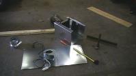 Solar Heat Exchanger Parts: Visible is the blower starter, angle iron used to bend the sheet metal
